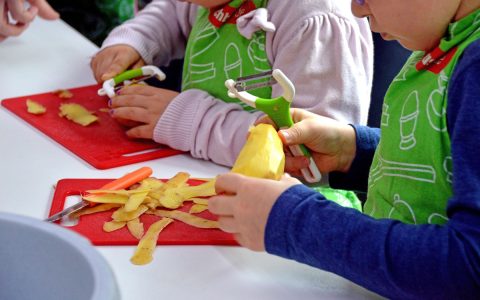 kids peeling potato