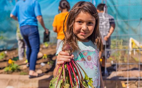 Girl in Vegetable Garden